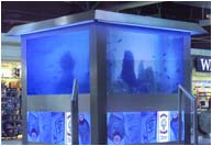 Fabricated stainless steel fish tank with blue tinted glass and cold cathode illumination, Heathrow Airport.