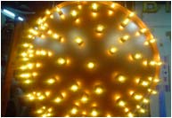 Vacformed acrylic globe sprayed copper + illuminated by yellow festoon lamps.